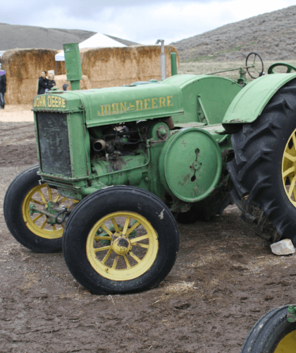 Old green John Deere tractor on display at Animal Days